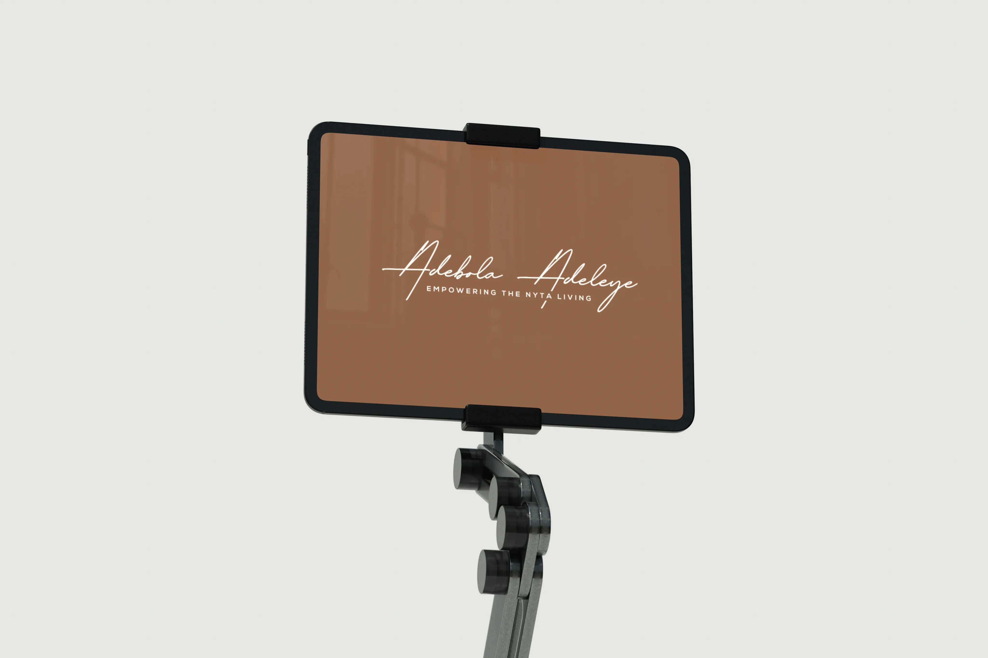 Adebola Adeleye website displayed on iPad mockup showcasing NYTA brand